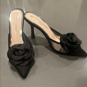 La Bottine Souriante Black Satin Heels with Floral Embellishment